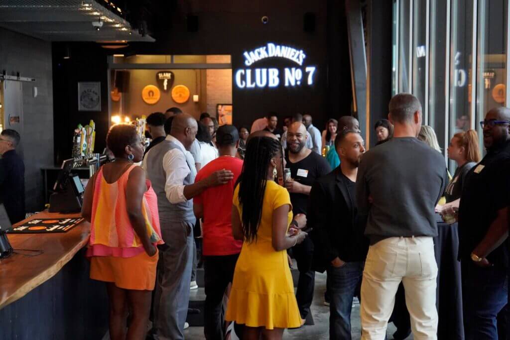 Crowd gathered at a Spedidit Enterprise event at Jack Daniel's Club No. 7